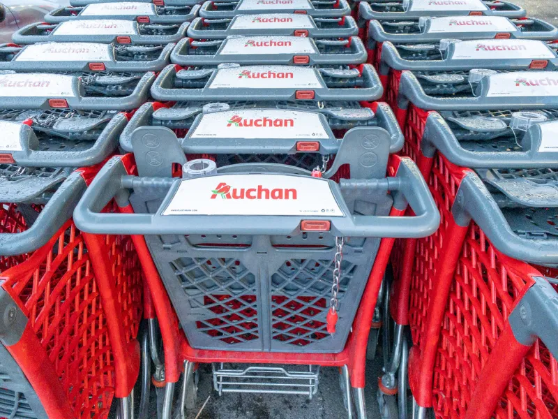 calais, france - january 14, 2020   close-up shopping trolleys auchan hypermarketauchan is a french international supermarket chain, is one of the largest distribution groups in the world