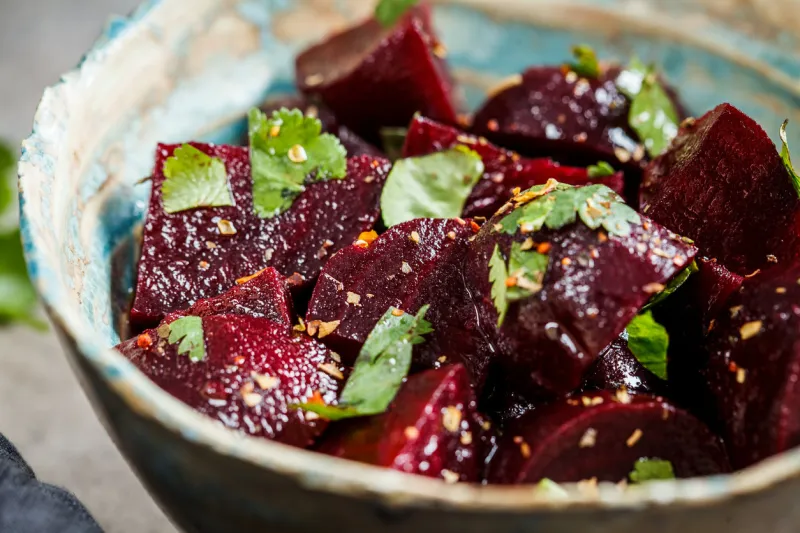 baked beetroot salad with cilantro in a bowl healthy vegan food concept