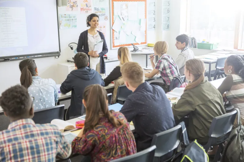 teacher and students in classroom during lesson