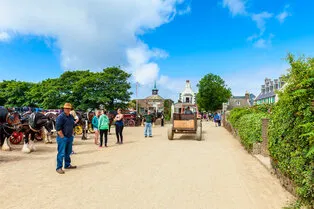 sark, united kingdom - july 5, 2013  unpaved street with horse carriages in the village, the center of sark, channel islands, uk no cars or trucks are allowed on sark