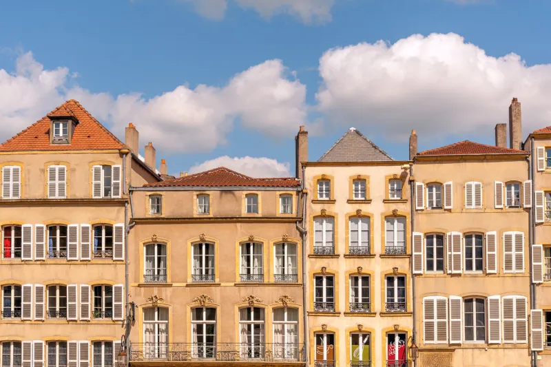 typical old houses with chimneys along place de chambre town square in metz, france