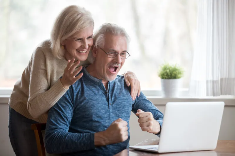 happy aged spouses looking on pc screen feels happy received unbelievable great news, enjoying celebrating win online lottery senior positive wife husband founding out about sale and huge discounts