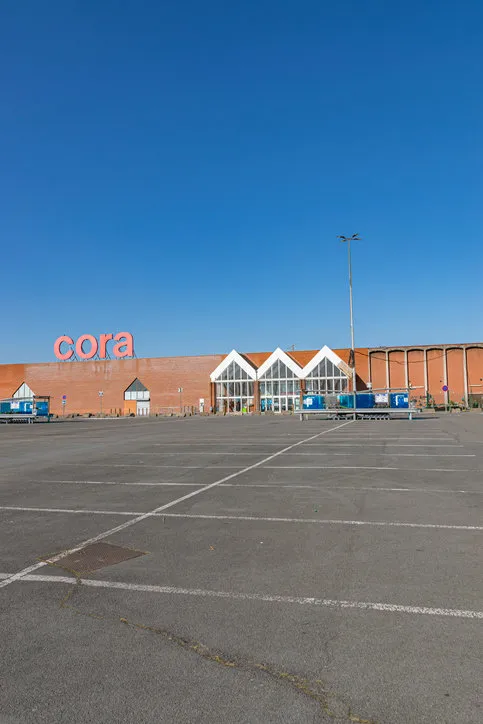 villeneuve d'ascq,france-february 28,2021  view of cora hypermarket,entrance and parkingcora is a belgian international supermarket chain cora was founded in