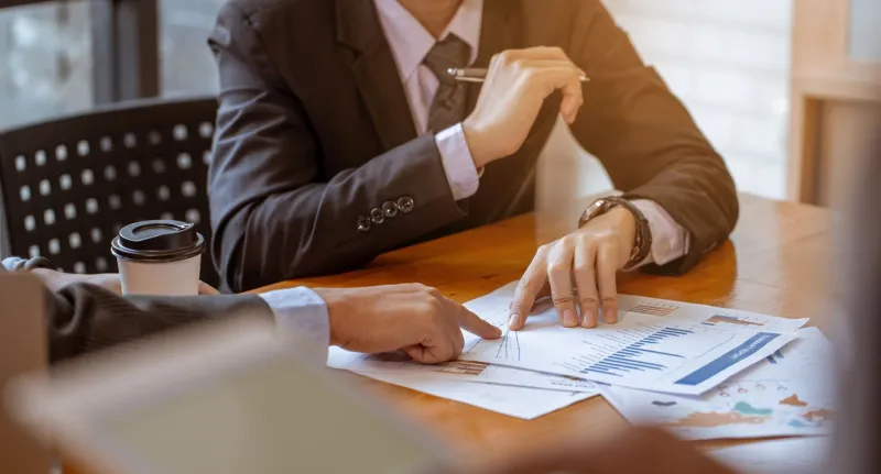 businessman receive counseling from colleague, it is a picture of the working atmosphere of company employees in the office in the early 21st century
