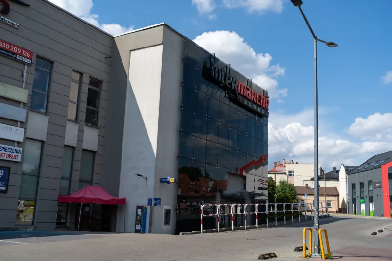 trzebinia, poland - june 18, 2023  intermarché store with logo sign french commercial supermarket chain shop, part of the les mousquetaires retail group intermarche hypermarket signboard with brand logotype