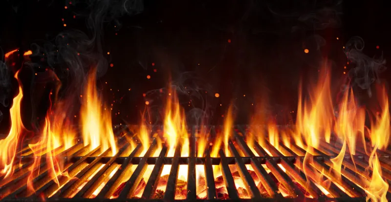 barbecue grill with fire flames - empty fire grid on black background