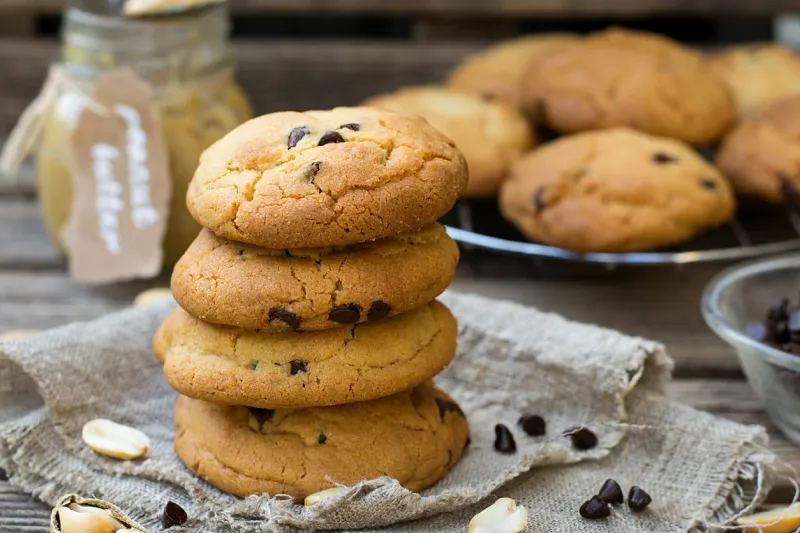 peanut butter sweet cookies with chocolate chips on wooden background