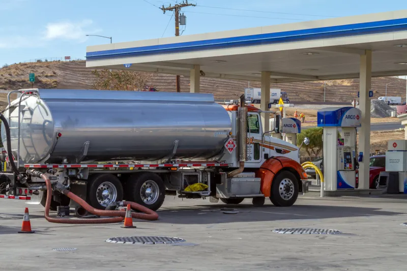 victorville, ca   usa – november 13, 2019  a gas tanker trunk servicing the arco gas station on d street in victorville, california