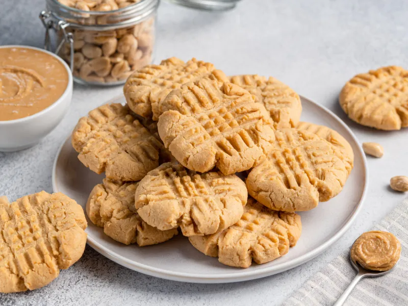 peanut butter cookies on ceramic plate close-up view light grey concrete background morning breakfast or lunch tasty snack
