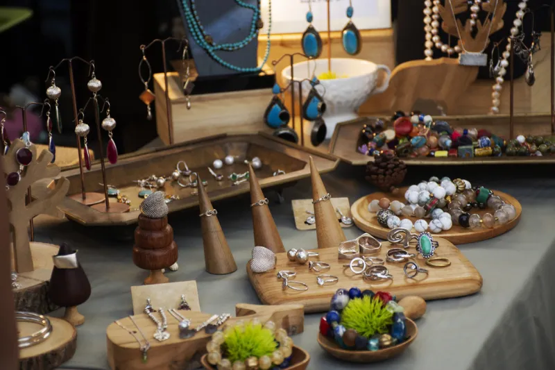 many colorful and luxury fashion accessories handmade shop for sale to travelers people buy at street market in bangkok, thailand