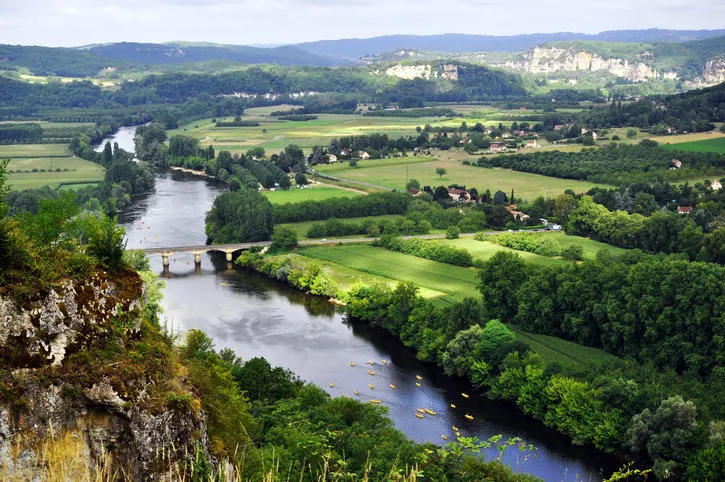 aerial view of a bridge over the dordogne river seen from the village of domme