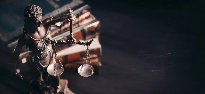 lady justice statue of justice in library legal and law background concept