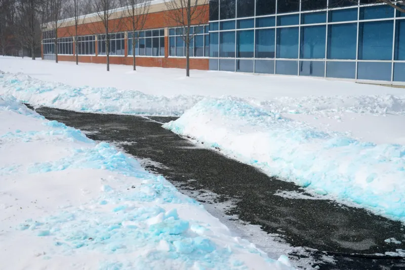sidewalk outside office building with snow removed