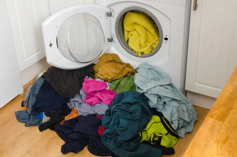 washing machine, colorful clothes pile of laundry