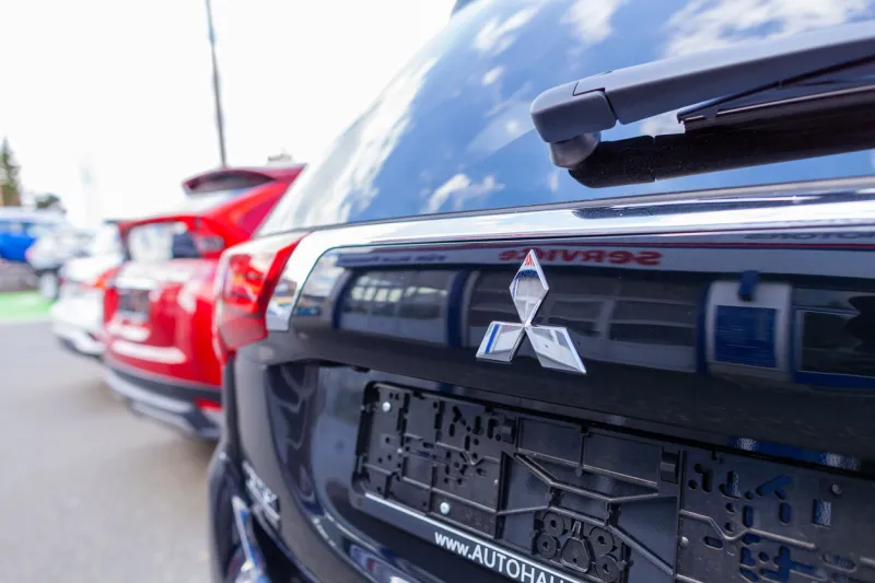 nuremberg   germany - april 7, 2019  mitsubishi logo on a mitsubishi car at a car dealer mitsubishi motors corporation is a japanese multinational automotive manufacturer headquartered in japan