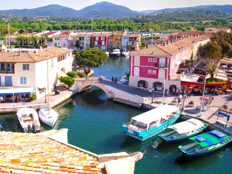 yacht harbor in port grimaud, south of france port grimaud is part of the village grimaud, near saint-tropez port grimaud is a seaside town on the bay of saint tropez it was built with channels in a venetian manner, but the houses are in provence style
