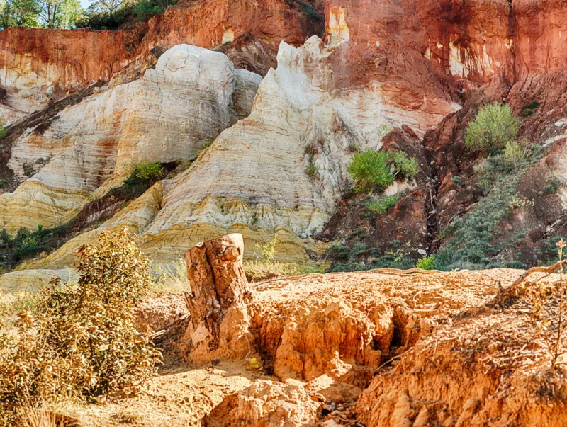 outside the town of rustrel, there is an area of eroded hills that show exposed, colorful clay