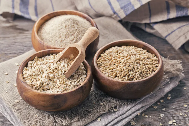 oat flakes, seeds and bran in bowls
