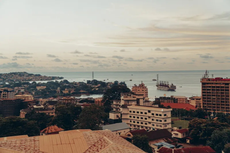 photo of freetown, sierra leone in the evening hours with sunset sky