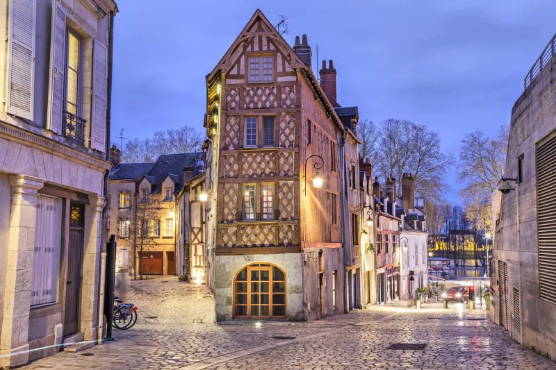 street, paved with stone blocks and half-timbered house in the center of orleans, france