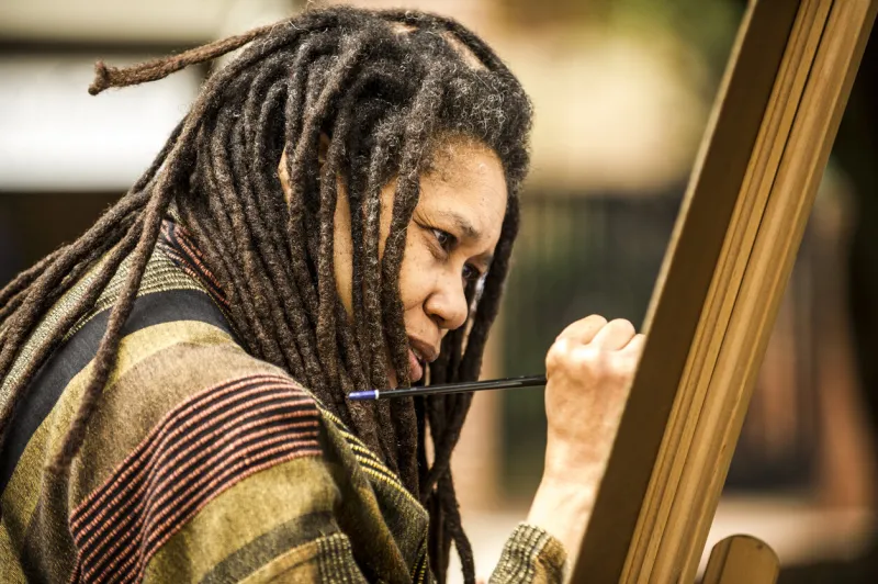 raleigh, north carolina, usa - october 10, 2012  local artist, linda dallas, paints for the opening of the gregg museum of art and design at north carolina state university