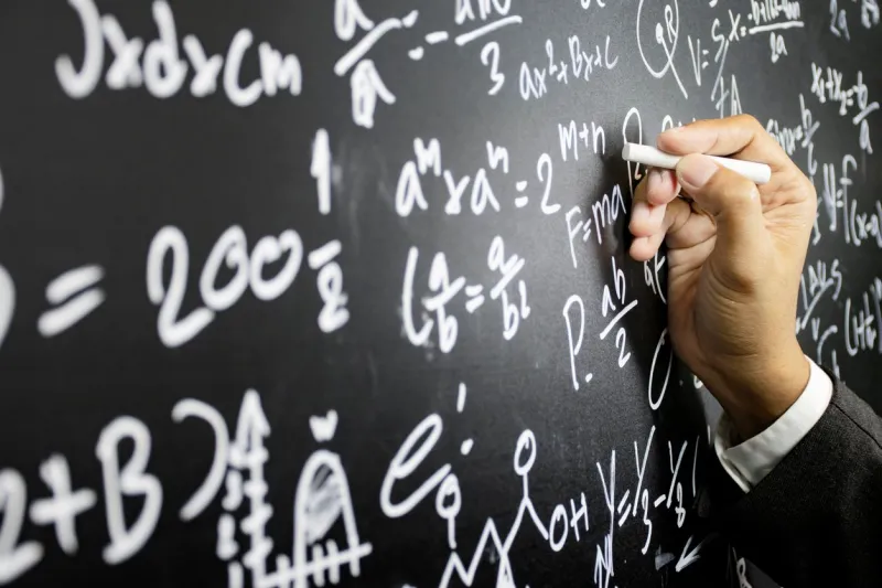mathematical concepts the teacher explained math problems to students by writing intelligence problems on the blackboard