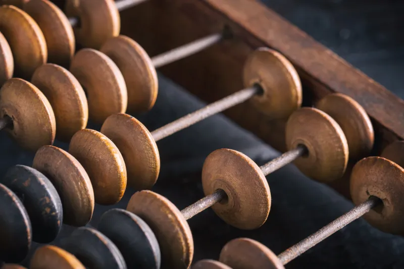 vintage old accounting wooden abacus close up toned image
