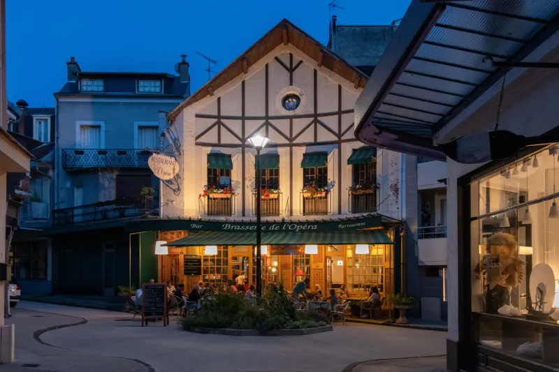 orléans, france - july, 7 2021  lights on a restaurants in vichy old town