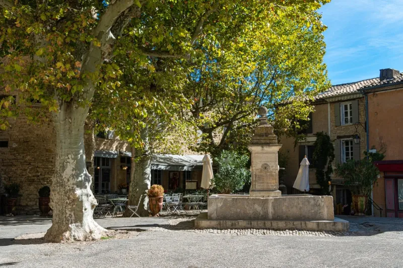 fountain in medieval village of gordes , provance , france