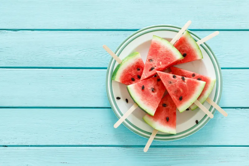 watermelon slice popsicles, blank food bacground with space for a text, top view