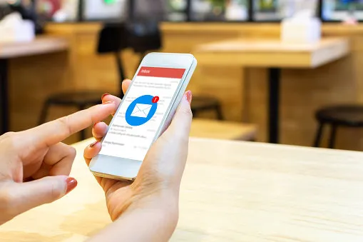 hand of female checking application email on smart phone notification new messages on mobile smartphone