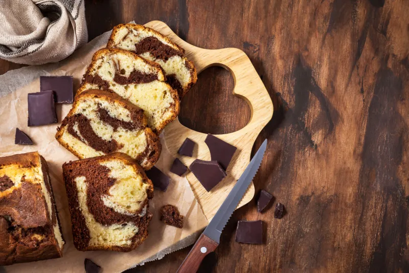 delicious homemade marble pound cake on wooden background, top view