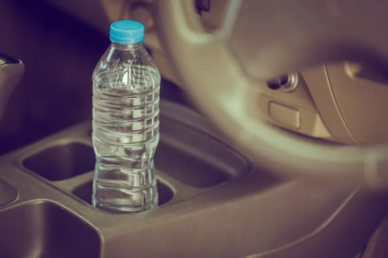 image concept bottled water was left in the car for a long time to drink it?