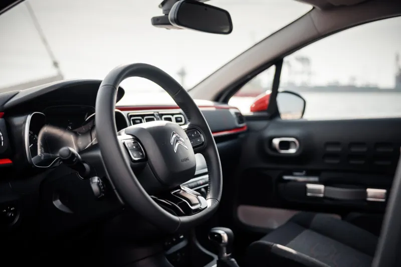 steering wheel and dashboard of compact hatchback by the sea odesa, ukraine - may