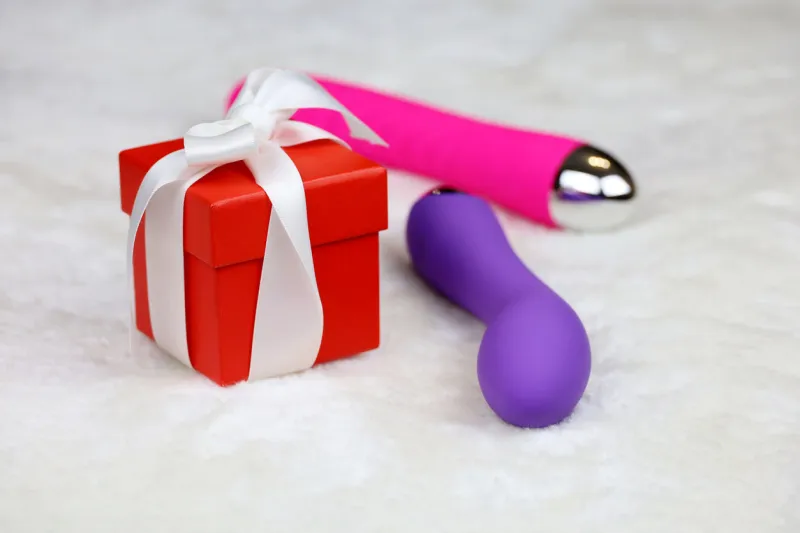 purple silicone vibrator and red dildo for adult games