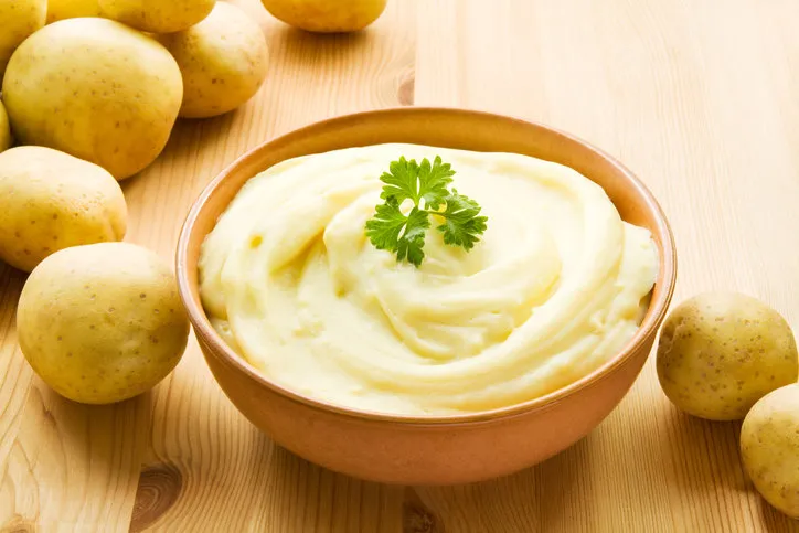 bowl with mashed potatoes decorated with potatoes