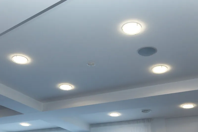 modern layered ceiling with embedded lights and stretched ceiling inlay, lights on