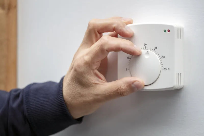 central heating thermostat control dial adjustment