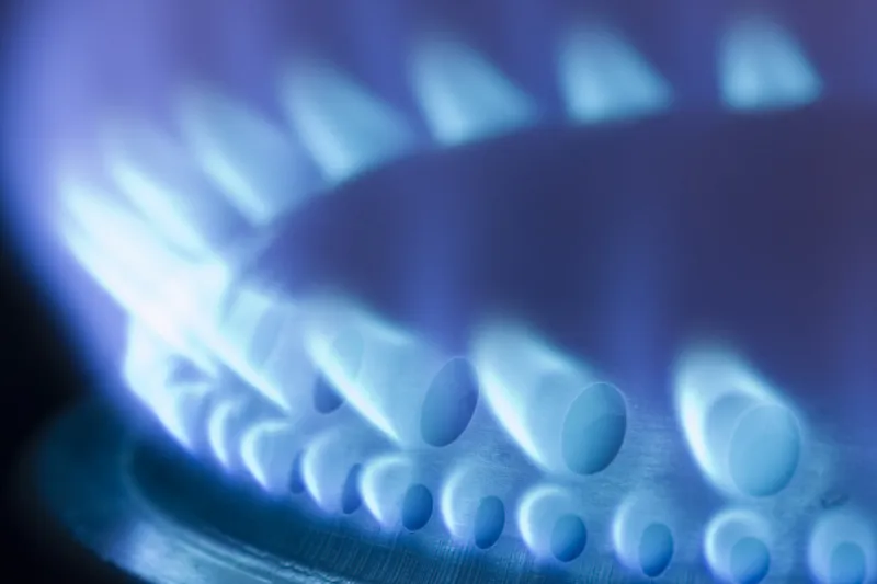 blue flames of a gas stove in the dark