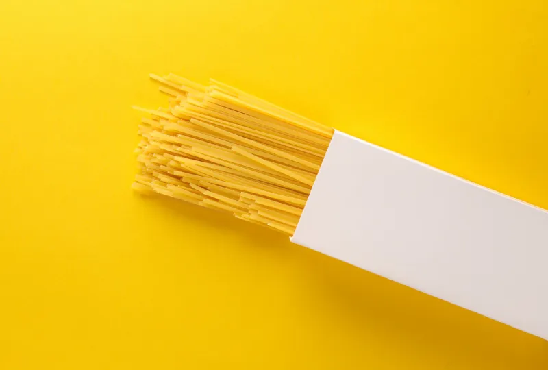 white box mockup of italian pasta on yellow background template for design