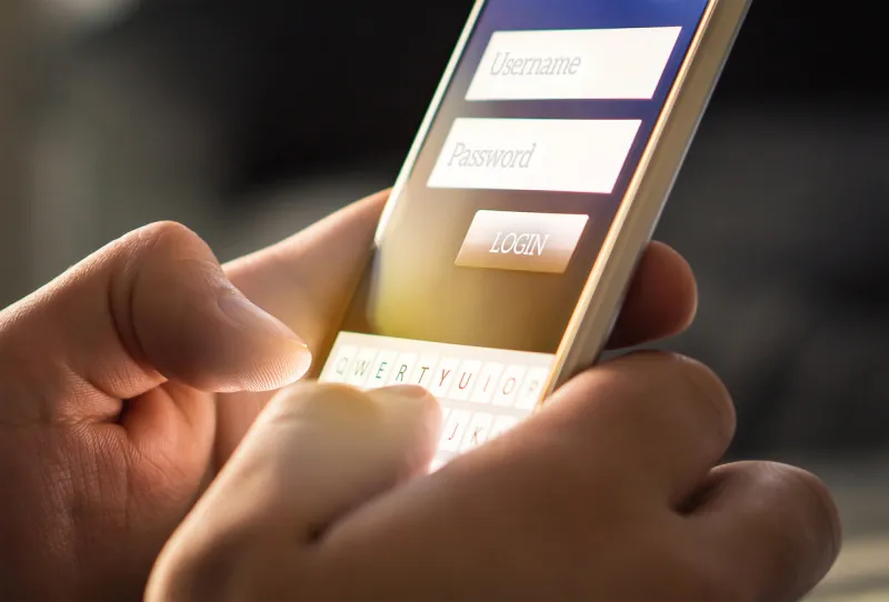 login with smartphone to online bank account or personal information on internet registration to social media app hands typing and entering username and password to an imaginary mobile application