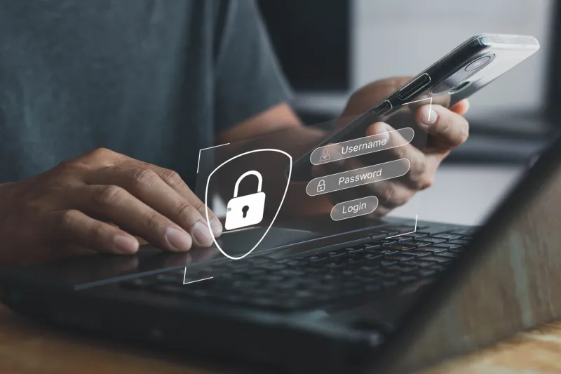 concept of cyber security, information security and encryption man hand typing on a keyboard with login and password on-screen display login, password, data protection and secured internet access