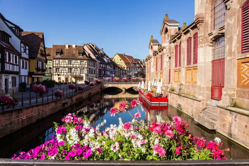 colmar, france, with its narrow streets and half-timbered medieval facades