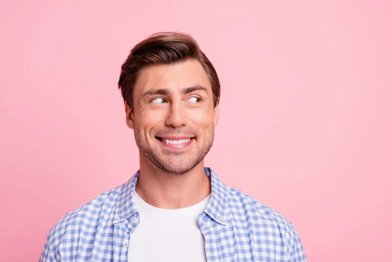 close up photo of amazing he him his man looking with wonder to empty space decided to make not good thing wearing casual plaid shirt outfit isolated on pale rose background