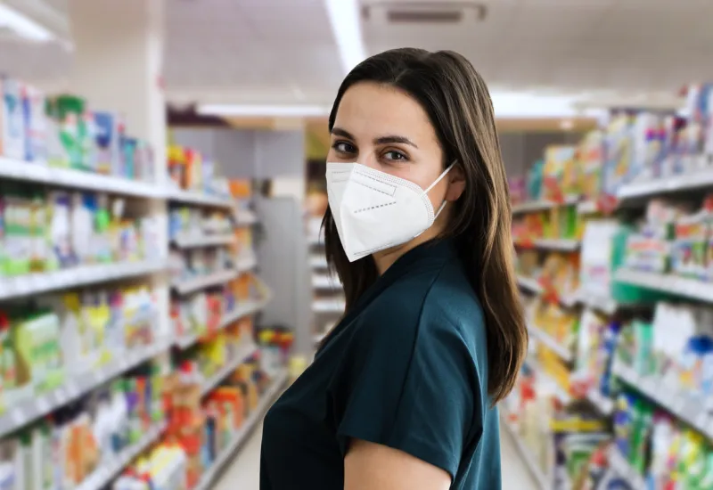 young customer woman shopping in face mask