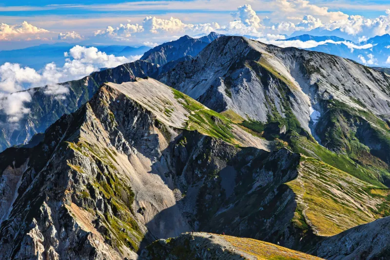 the ridgeline leading from mt shirouma in the northern alps to the ushiro tateyama mountain range in japan