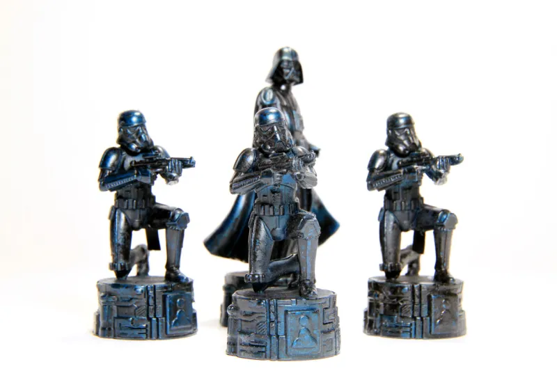 vancouver, canada - february 26, 2012  darth vader and stormtroopers from the star wars film franchise against a white background the models are from the star wars chess set