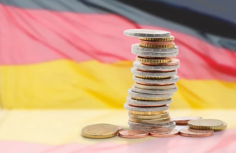 coins stacked on each other in different positions with germany flag