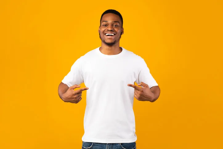 african american man pointing at himself posing standing in studio over yellow background look at me concept