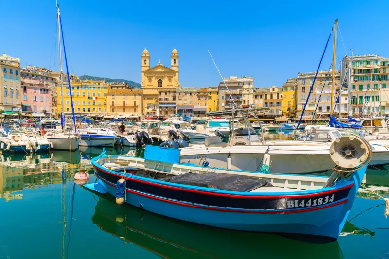 bastia port, corsica island - jul 4, 2015  colorful fishing boat in bastia harbour on sunny summer day, corsica island, france